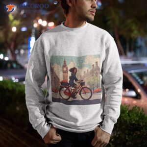 woman on bicycle in westminster london shirt sweatshirt