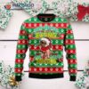 French Bulldog Wearing An Ugly Christmas Sweater Seen Eating Snacks