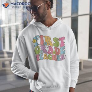 groovy first grade teacher happy day of school kids shirt hoodie 1