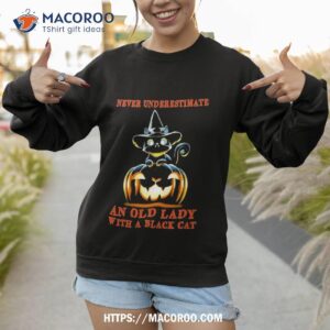 never underestimate an old lady with a black cat halloween pumpkin shirt sweatshirt