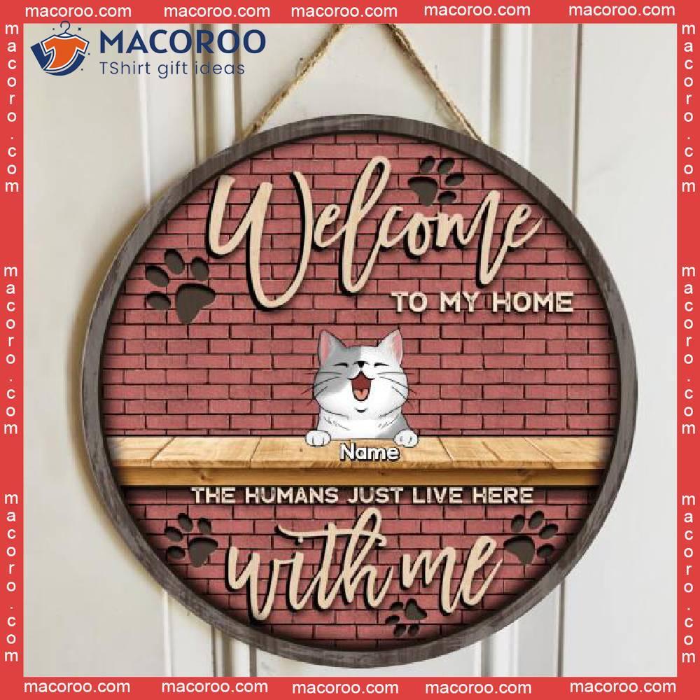 https://images.macoroo.com/wp-content/uploads/2023/08/welcome-to-our-home-the-humans-just-live-here-with-us-brick-wall-personalized-cat-breed-wooden-signs-0.jpg