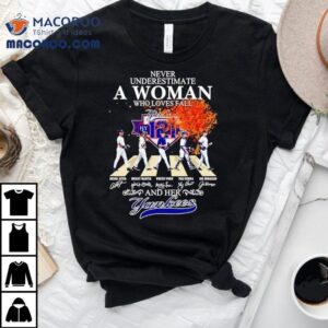 Never Underestimate A Woman Who Loves Fall And Her New York Yankees Walking Across Tshirt