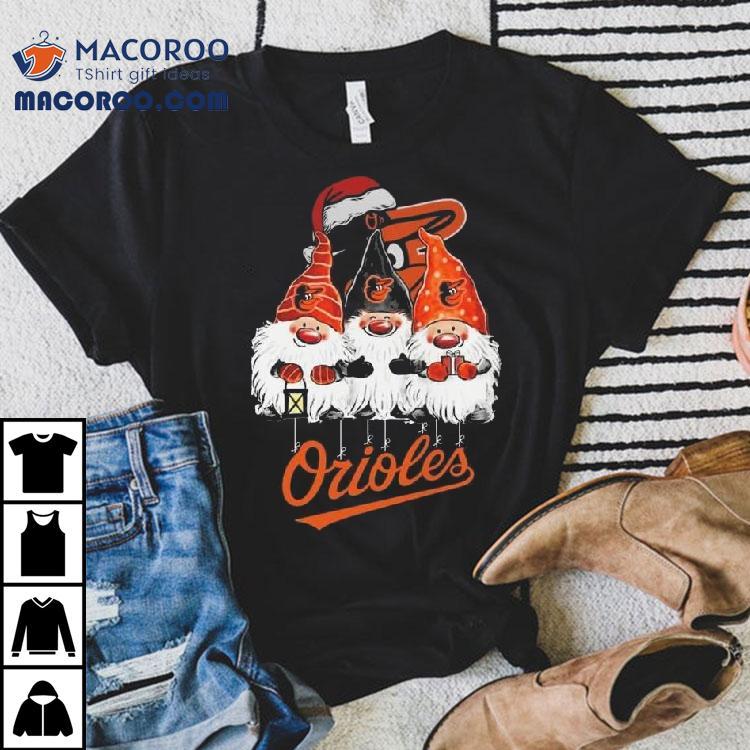 The Gnomes X Baltimore Orioles Merry Christmas 2025 Shirt The Gnomes X Baltimore Orioles Merry Christmas 2025 Shirt
