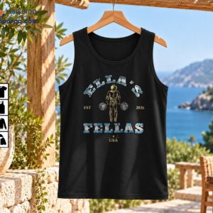Fellas vintage graphic with distressed blue lettering, gold accents, a central pom-pom figure, EST 2026, and USA