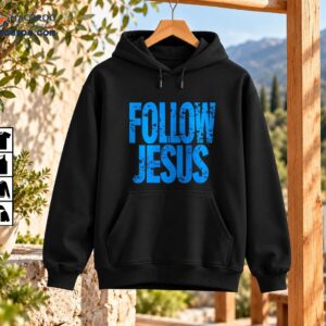 Follow Jesus shirt design with bold distressed blue lettering and a rugged vintage-inspired Christian graphic