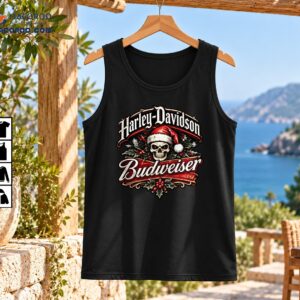 Vintage Christmas skeleton graphic with Harley-Davidson and Budweiser lettering, a Santa hat skull, holly, and red berries