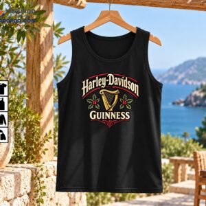 Harley-Davidson and Guinness vintage Christmas design with gold lettering, a golden harp, green holly, red berries, and ornate scrollwork