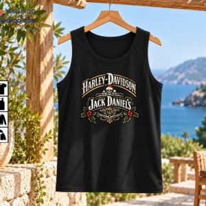 Vintage Christmas skeleton graphic with Harley-Davidson and Jack Daniel's lettering, Santa hat skull, gold scrollwork, and red holly berries