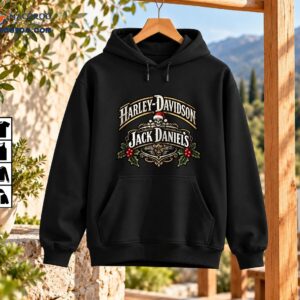 Vintage Christmas skeleton graphic with Harley-Davidson and Jack Daniel's lettering, Santa hat skull, gold scrollwork, and red holly berries