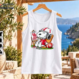 Smiling white cartoon dog in a red number 1 football jersey and helmet beside a Houston Cougars football easel and ball.