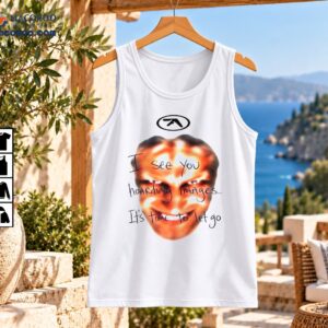 Distorted orange grinning face with black oval symbol and handwritten I See You Hoarding Images It's Time To Let Go text