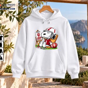 Snoopy in a crimson number 1 football uniform painting an Indiana Hoosiers sign beside a football and art supplies