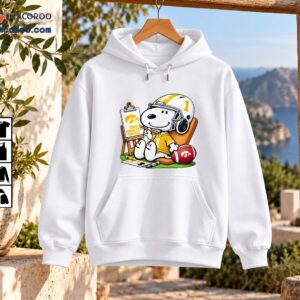 Snoopy in a gold number 1 football jersey and white helmet painting Iowa Hawkeyes Football beside a red football