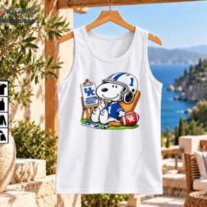 Kentucky Wildcats Football Snoopy Painting Number 1 Shirt 2 Snoopy in a blue number 1 football jersey and white helmet beside a UK football easel and red football