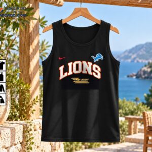 Lions ZZ Top The Big One Vintage Graphic Shirt 2 LIONS ZZ Top graphic with silver varsity lettering, orange-red outlines, blue leaping lion emblem, red swoosh, and gold logo