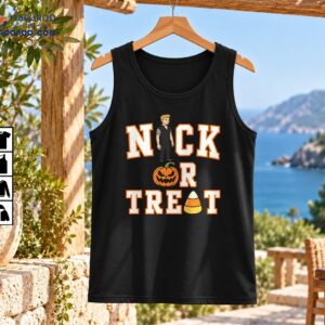 Nick Or Treat Halloween graphic with blond cartoon boy, orange jack-o'-lantern, candy corn and varsity letters