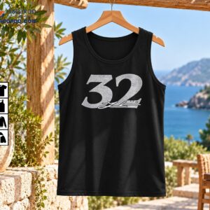 Silver distressed number 32 baseball graphic with a flowing signature-style detail underneath