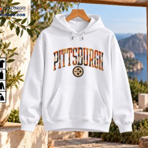 Pittsburgh Steelers shirt design with distressed arched varsity lettering and a circular emblem in orange, gold, cream, and charcoal