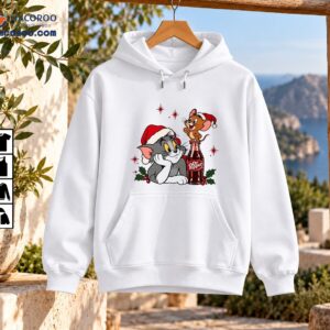 Vintage Christmas cartoon showing a gray cat and smiling brown mouse in Santa hats beside a soda bottle with holly and red berries