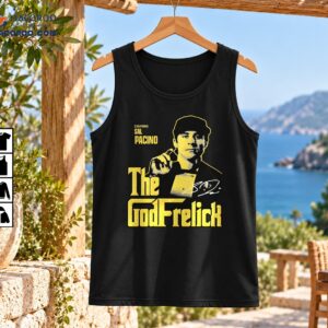 GodFreilich Sal Pacino shirt design with a suited portrait, distressed gold lettering, and white signature detail