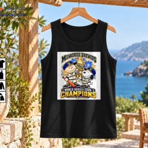 Charlie Brown and Snoopy in Brewers uniforms with a golden trophy, blue and gold fireworks, and World Series 2026 Champions lettering
